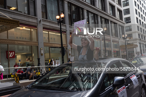 Chicago Teachers Union members and supporters join a car caravan outside Chicago Public Schools (CPS) headquarters while a Chicago Board of...