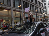 Chicago Teachers Union members and supporters join a car caravan outside Chicago Public Schools (CPS) headquarters while a Chicago Board of...