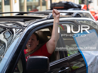 Chicago Teachers Union members and supporters join a car caravan outside Chicago Public Schools (CPS) headquarters while a Chicago Board of...