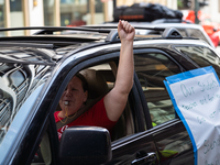 Chicago Teachers Union members and supporters join a car caravan outside Chicago Public Schools (CPS) headquarters while a Chicago Board of...