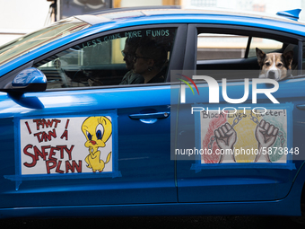 Chicago Teachers Union members and supporters join a car caravan outside Chicago Public Schools (CPS) headquarters while a Chicago Board of...