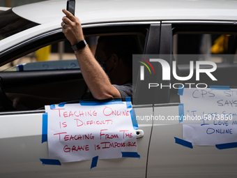 Chicago Teachers Union members and supporters join a car caravan outside Chicago Public Schools (CPS) headquarters while a Chicago Board of...