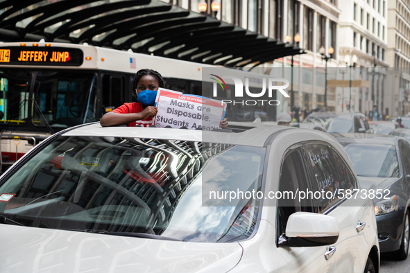 Chicago Teachers Union members and supporters join a car caravan outside Chicago Public Schools (CPS) headquarters while a Chicago Board of...