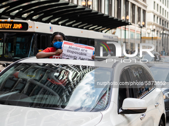 Chicago Teachers Union members and supporters join a car caravan outside Chicago Public Schools (CPS) headquarters while a Chicago Board of...