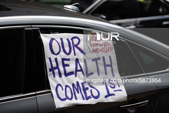 Chicago Teachers Union members and supporters join a car caravan outside Chicago Public Schools (CPS) headquarters while a Chicago Board of...