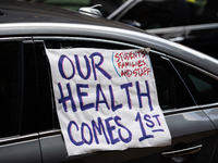 Chicago Teachers Union members and supporters join a car caravan outside Chicago Public Schools (CPS) headquarters while a Chicago Board of...