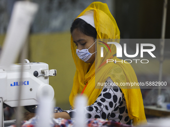 Ready made garments worker works in a garments factory in Dhaka on July 25, 2020. (