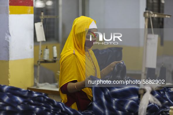 Ready made garments worker works in a garments factory in Dhaka on July 25, 2020. 