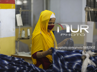 Ready made garments worker works in a garments factory in Dhaka on July 25, 2020. (