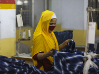 Ready made garments worker works in a garments factory in Dhaka on July 25, 2020. (