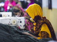 Ready made garments workers works in a garments factory in Dhaka on July 25, 2020. (