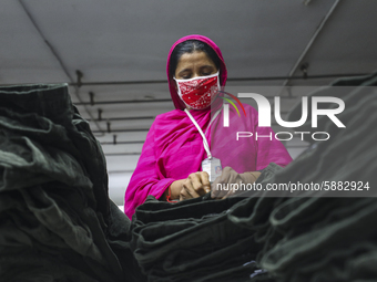 Ready made garments worker works in a garments factory in Dhaka on July 25, 2020. (