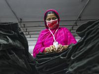 Ready made garments worker works in a garments factory in Dhaka on July 25, 2020. (