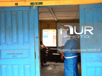 A teacher gives a lesson to students at Girls Junior Grammar School, S.W, Ikoyi, Lagos on August 3, 2020 on the first day after resumption o...