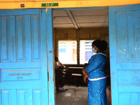 A teacher gives a lesson to students at Girls Junior Grammar School, S.W, Ikoyi, Lagos on August 3, 2020 on the first day after resumption o...