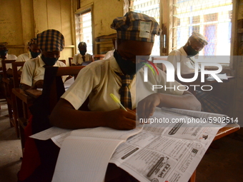 A High School female student wears a face mask while she reads in a classroom at Girls Junior Grammar School, S.W, Ikoyi, Lagos on August 3,...