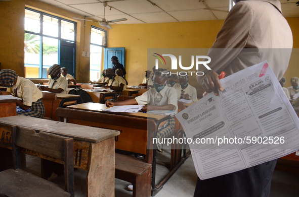 A teacher gives a lesson to students at Girls Junior Grammar School, S.W, Ikoyi, Lagos on August 3, 2020 on the first day after resumption o...