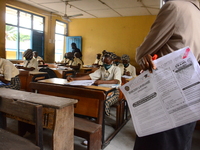 A teacher gives a lesson to students at Girls Junior Grammar School, S.W, Ikoyi, Lagos on August 3, 2020 on the first day after resumption o...