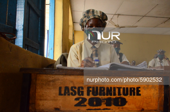 High School female students wears a face mask while they reads in a classroom at Girls Junior Grammar School, S.W, Ikoyi, Lagos on August 3,...