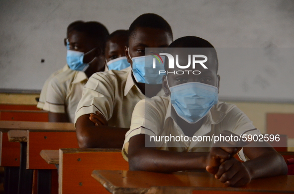 High School female students wears a face mask while they reads in a classroom at Ireti Junior Grammar Schol, Ikoyi, Lagos on August 3, 2020...