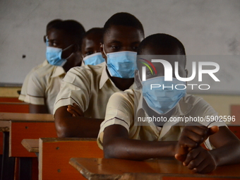 High School female students wears a face mask while they reads in a classroom at Ireti Junior Grammar Schol, Ikoyi, Lagos on August 3, 2020...