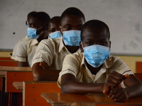 High School female students wears a face mask while they reads in a classroom at Ireti Junior Grammar Schol, Ikoyi, Lagos on August 3, 2020...