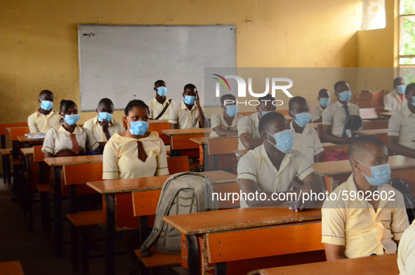 High School female students wears a face mask while they reads in a classroom at Ireti Junior Grammar Schol, Ikoyi, Lagos on August 3, 2020...