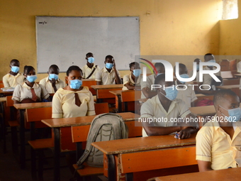 High School female students wears a face mask while they reads in a classroom at Ireti Junior Grammar Schol, Ikoyi, Lagos on August 3, 2020...