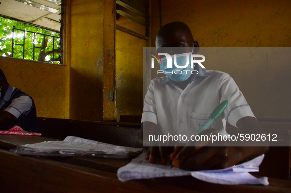 High School students wears a face mask while they reads in a classroom at Ireti Junior Grammar Schol, Ikoyi, Lagos on August 3, 2020 on the...