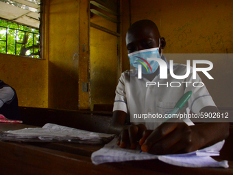 High School students wears a face mask while they reads in a classroom at Ireti Junior Grammar Schol, Ikoyi, Lagos on August 3, 2020 on the...