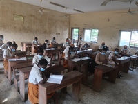 Final year students of Agidingbi Senior Grammar School, Ikeja, Lagos, Nigeria with facemasks sit in a classroom as they resume school after...