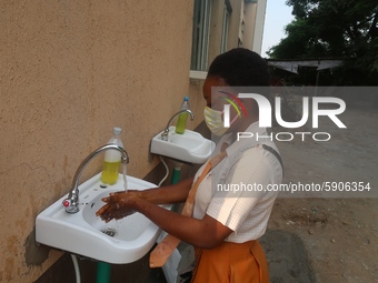 Final year student of Agidingbi Senior Grammar School, Ikeja, Lagos, Nigeria washes her hands as schools resume after COVID-19 lockdown orde...