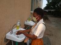 Final year student of Agidingbi Senior Grammar School, Ikeja, Lagos, Nigeria washes her hands as schools resume after COVID-19 lockdown orde...