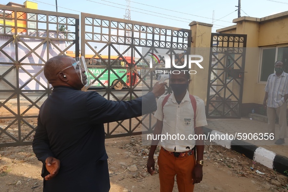 
Final year student of Agidingbi Senior Grammar School, Ikeja, Lagos, Nigeria has his temperature checked as schools resume after COVID-19...