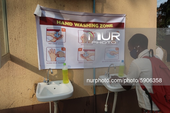 Final year student of Agidingbi Senior Grammar School, Ikeja, Lagos, Nigeria washes his hands as schools resume after COVID-19 lockdown orde...