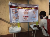 Final year student of Agidingbi Senior Grammar School, Ikeja, Lagos, Nigeria washes his hands as schools resume after COVID-19 lockdown orde...