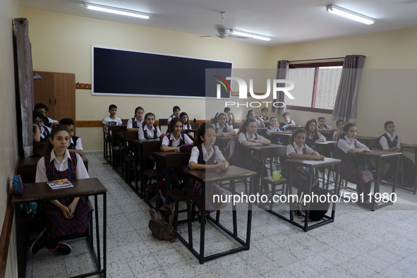 Palestinian schoolchildren sit inside a classroom in the rosary sisters school gaza , on the first day of a new school year, as Palestinians...