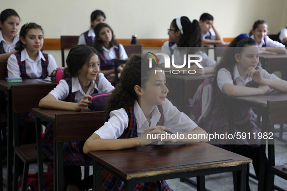 Palestinian schoolchildren sit inside a classroom in the rosary sisters school gaza , on the first day of a new school year, as Palestinians...