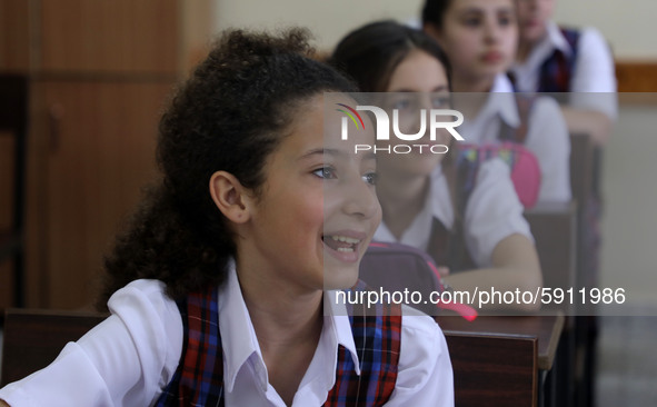 Palestinian schoolchildren sit inside a classroom in the rosary sisters school gaza , on the first day of a new school year, as Palestinians...