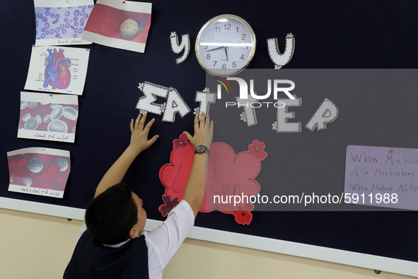 Palestinian schoolchildren sit inside a classroom in the rosary sisters school gaza , on the first day of a new school year, as Palestinians...