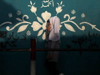 Students walk to the United-Nation run Elementary School on the first day of the new school year as Palestinians ease the coronavirus diseas...