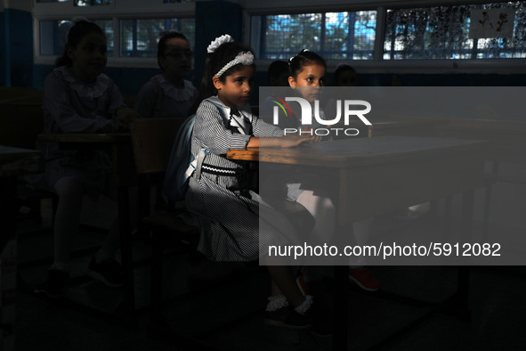 Palestinian students sit in a classroom at a United-Nations run school as a new school year begins as Palestinians ease the coronavirus dise...