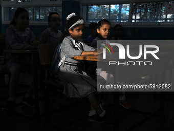 Palestinian students sit in a classroom at a United-Nations run school as a new school year begins as Palestinians ease the coronavirus dise...