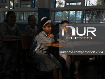 Palestinian students sit in a classroom at a United-Nations run school as a new school year begins as Palestinians ease the coronavirus dise...