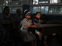 Palestinian students sit in a classroom at a United-Nations run school as a new school year begins as Palestinians ease the coronavirus dise...