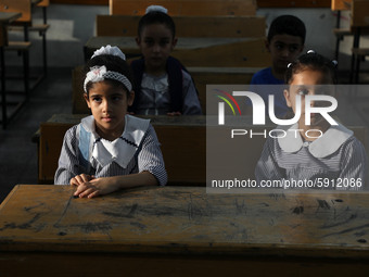 Palestinian students sit in a classroom at a United-Nations run school as a new school year begins as Palestinians ease the coronavirus dise...