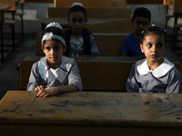 Palestinian students sit in a classroom at a United-Nations run school as a new school year begins as Palestinians ease the coronavirus dise...