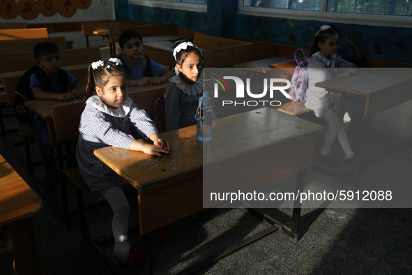 Palestinian students sit in a classroom at a United-Nations run school as a new school year begins as Palestinians ease the coronavirus dise...