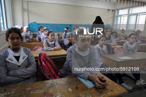 Palestinian students sit in a classroom at a United-Nations run school as a new school year begins as Palestinians ease the coronavirus dise...