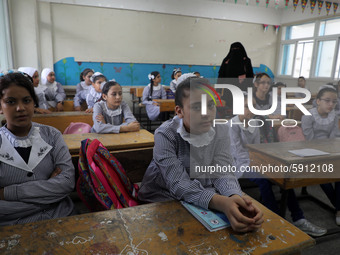 Palestinian students sit in a classroom at a United-Nations run school as a new school year begins as Palestinians ease the coronavirus dise...